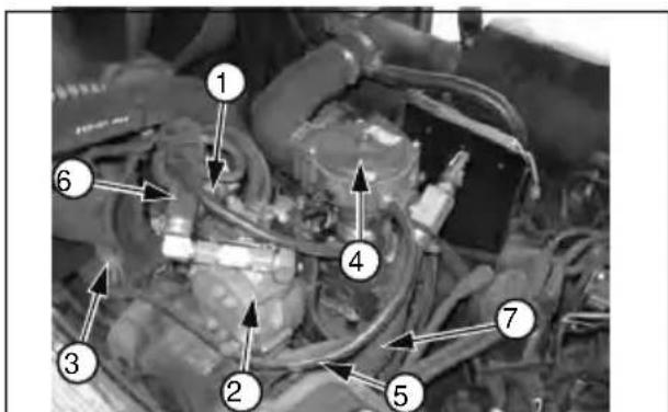 Labeled mechanical diagram showing numbered components of a vehicle engine or engine assembly
