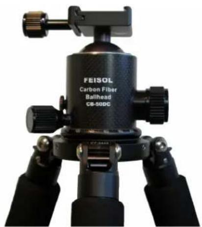 Close-up of a black FeISOL Carbon Fiber Ballhead (GB-50DC) tripod mount with adjustable legs and head (no visible text or symbols on the device body beyond branding).