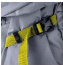 Close-up of a yellow and black safety belt buckle (no text or symbols visible)