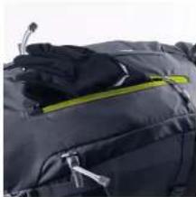 Close-up of a dark jacket with yellow trim and white zipper, no visible text or symbols