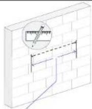 Technical diagram showing a brick wall with a magnified inset of measurement markings and a blue line indicating a path or measurement.