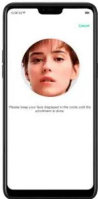 Please keep your face displayed in the circle until the enrollment is close.
