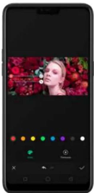 Smartphone screenshot displaying a video thumbnail with a woman's face and color adjustment sliders below.