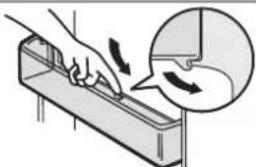 Illustration of a hand using a tool to cut a rectangular object, with an inset showing the process (no text or symbols)