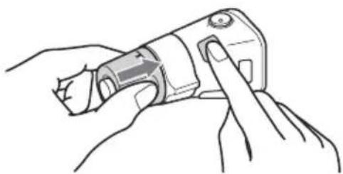 Line drawing of hands holding a mechanical tool with a finger inserted (no text or symbols)