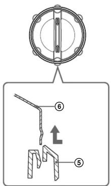 Technical diagram showing a mechanical component with labeled parts and an arrow indicating direction.