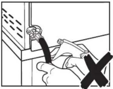 Illustration of a hand using a tool to clean or install a wall-mounted device (no text or symbols visible)