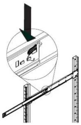 Diagram showing a mechanical setup with a ruler and a magnified inset of a component, likely illustrating a measurement or alignment process.