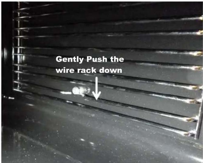 Gently Push the wire rack down