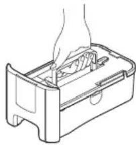 Line drawing of a hand inserting into a device into a rectangular box (no text or symbols)