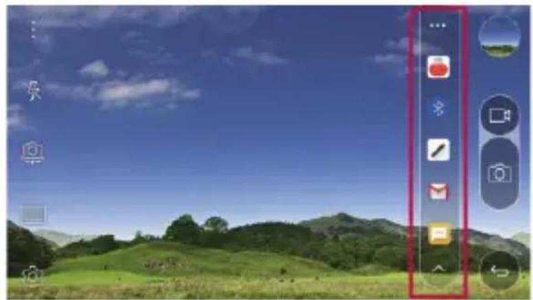 Desktop screenshot showing a green landscape with icons and a red vertical tab on the right, likely from an older application or website.