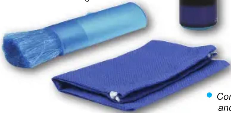 Blue textured fabric item with a brush and cap, partially covered by a white object (no visible text or symbols)