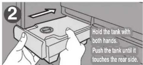 2 Hold the tank with both hands. Push the tank until it touches the rear side.