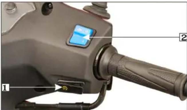 Close-up of a mechanical device with labeled parts, showing a lever and adjustment knob