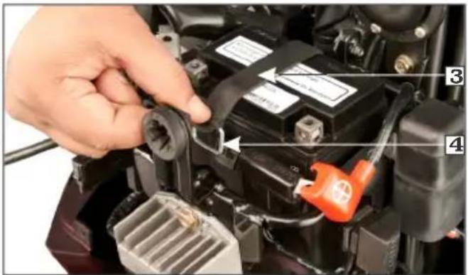 Close-up of a hand installing or adjusting a mechanical component with numbered parts labeled 3 and 4.