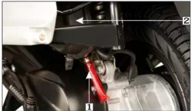 Technical diagram of a vehicle suspension system with labeled components and directional arrows