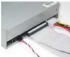 Close-up of a silver printer with attached cable and paper strips (no visible text or symbols)