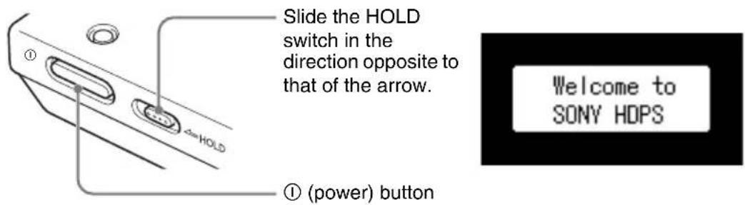 Slide the HOLD switch in the direction opposite to that of the arrow. ① (power) button ① Welcome to SONY HDPS