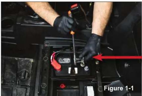 Person working on a battery component with red arrows indicating direction (no text or symbols visible)