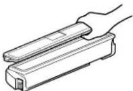 Line drawing of a hand holding a rectangular object (no text or symbols)