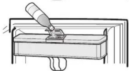 Line drawing of a tool applying material to a component (no text or symbols)