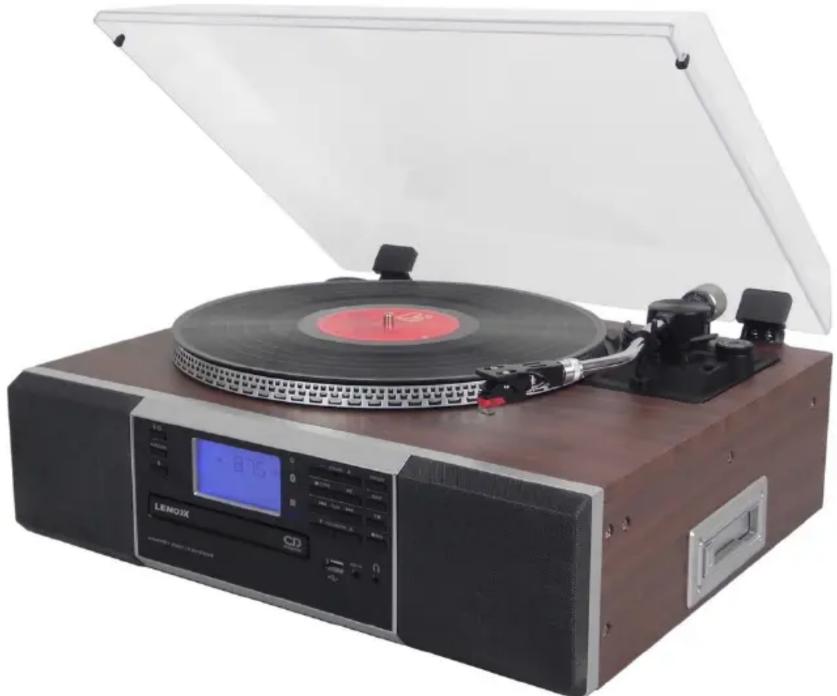 Vintage LEMOX music<|im_start|> Dominica (LMOX) with open lid and digital display, no visible text or symbols on the device itself.