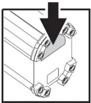 Technical diagram showing a mechanical assembly with a downward arrow indicating force or direction (no text or symbols present)