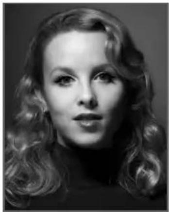 Black-and-white portrait of a woman with wavy hair (no text or symbols visible)