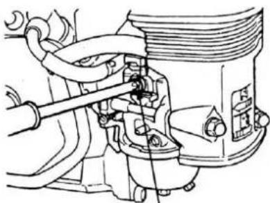 Technical line drawing of a mechanical assembly with hoses and components (no text or labels)
