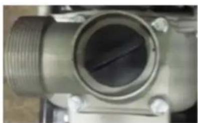 Close-up of a metallic mechanical valve component with threaded end and central hub (no visible text or symbols)