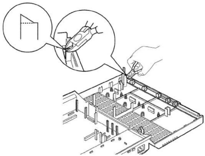 Technical diagram showing a hand using a tool to cut a component, with an inset magnified view highlighting the process.