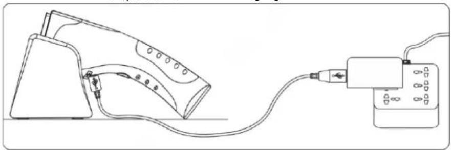 Line drawing of a washing machine connected to a power cord (no text or symbols)