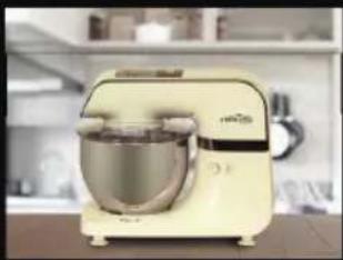 Modern kitchen mixer with a round head and metallic bowl, no visible text or symbols