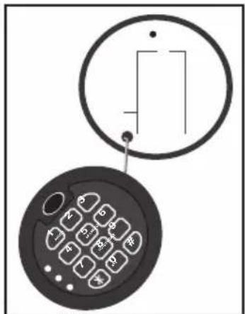 Diagram showing a circular component with a rectangular outline and an inset of a keypad with numeric keypad layout.