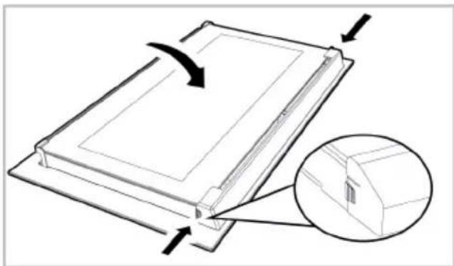 Diagram of a mechanical component with an arrow indicating rotation and a magnified inset showing a detail (no text or symbols)