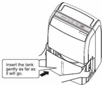 Insert the tank gently as far as it will go.