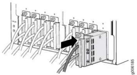 Diagram showing cable connection between industrial equipment with labeled components and a black arrow indicating direction
