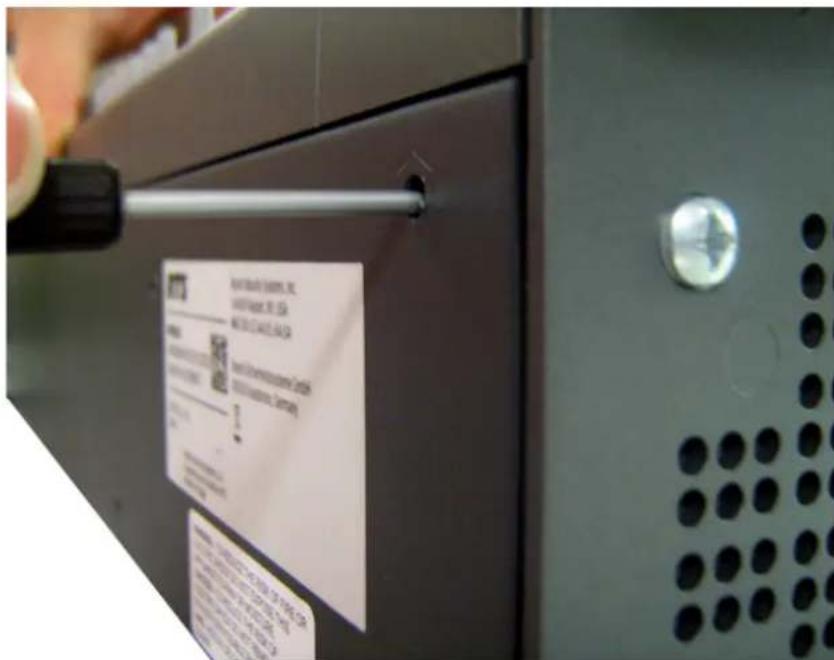 Close-up of a refrigerator door with a visible label showing product information and QR code.