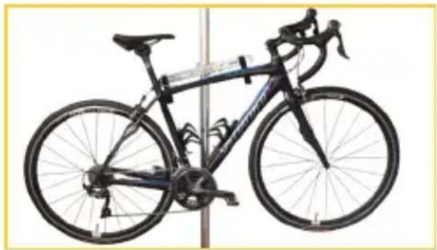 Black bicycle parked on a vertical stand, no visible text or symbols