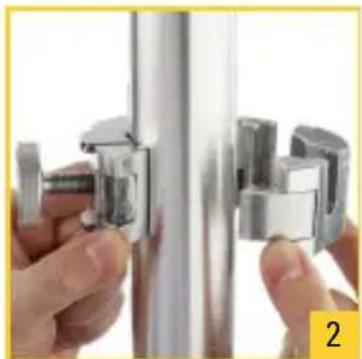 Close-up of hands adjusting a metallic wall-mounted fixture (no text or symbols visible)
