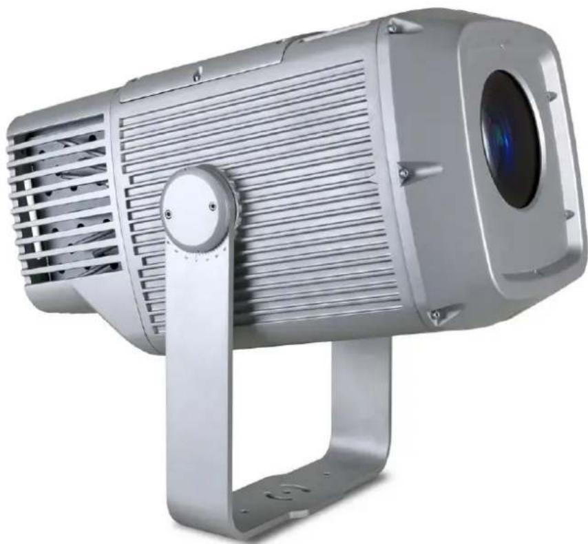 Exterior view of a silver projector with ventilation grilles and a circular lens (no text or symbols visible)