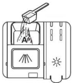 Diagram showing a griddle pouring liquid into a device with labeled components and warning symbols