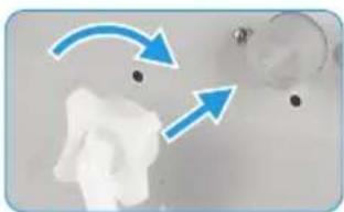 Close-up of a white object with blue arrows indicating motion or direction, no visible text or symbols