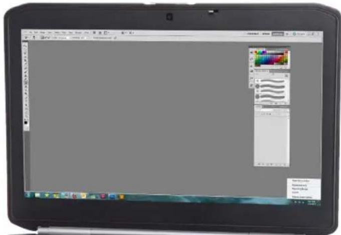 Screenshot of a desktop computer with visible taskbar, color palette, and application icons on the screen