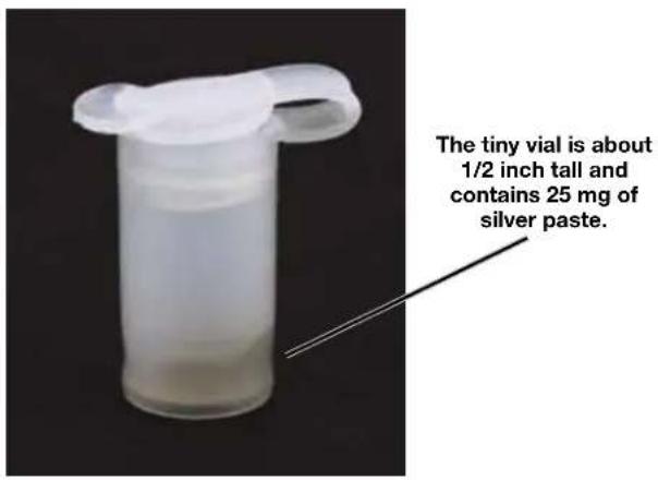 The tiny vial is about 1/2 inch tall and contains 25 mg of silver paste.