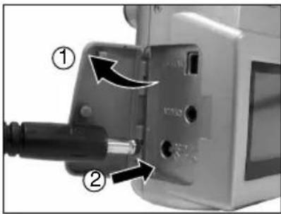 Diagram of a mechanical device with labeled parts and directional arrows indicating assembly or movement.