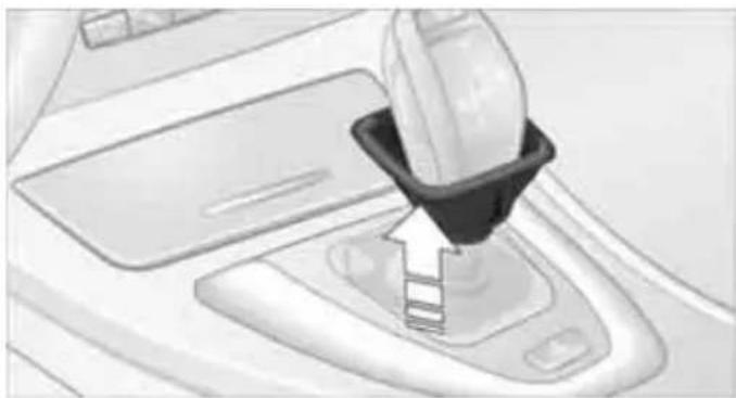 Close-up of a car gear shift lever mechanism (no text or symbols visible)