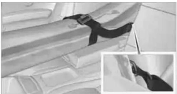 Interior view of a vehicle cabin with a black belt and seatbelt, showing structural details (no visible text or symbols)
