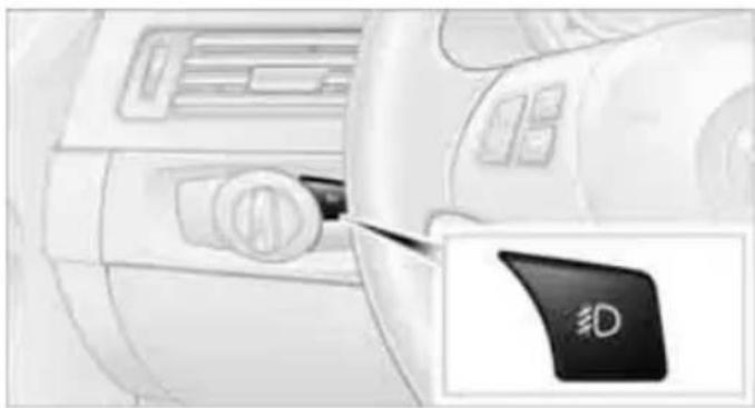 Interior view of a car dashboard with a black 'ED' button and a close-up of the left side (no visible text or symbols beyond the button)