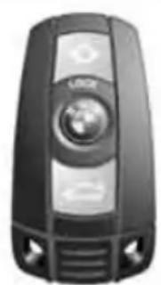 Black and white photo of a car key with a logo and directional arrow (no visible text or symbols)